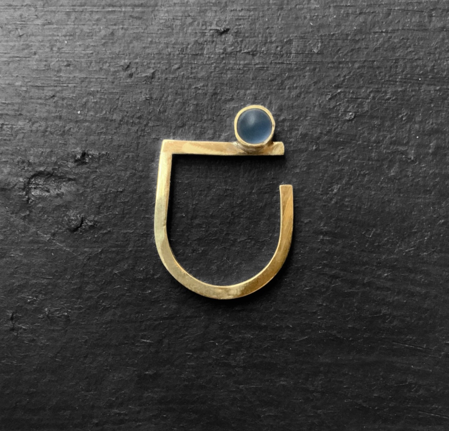 Handmade gold ring with a frosted blue glass accent, inspired by contemportary Greek art