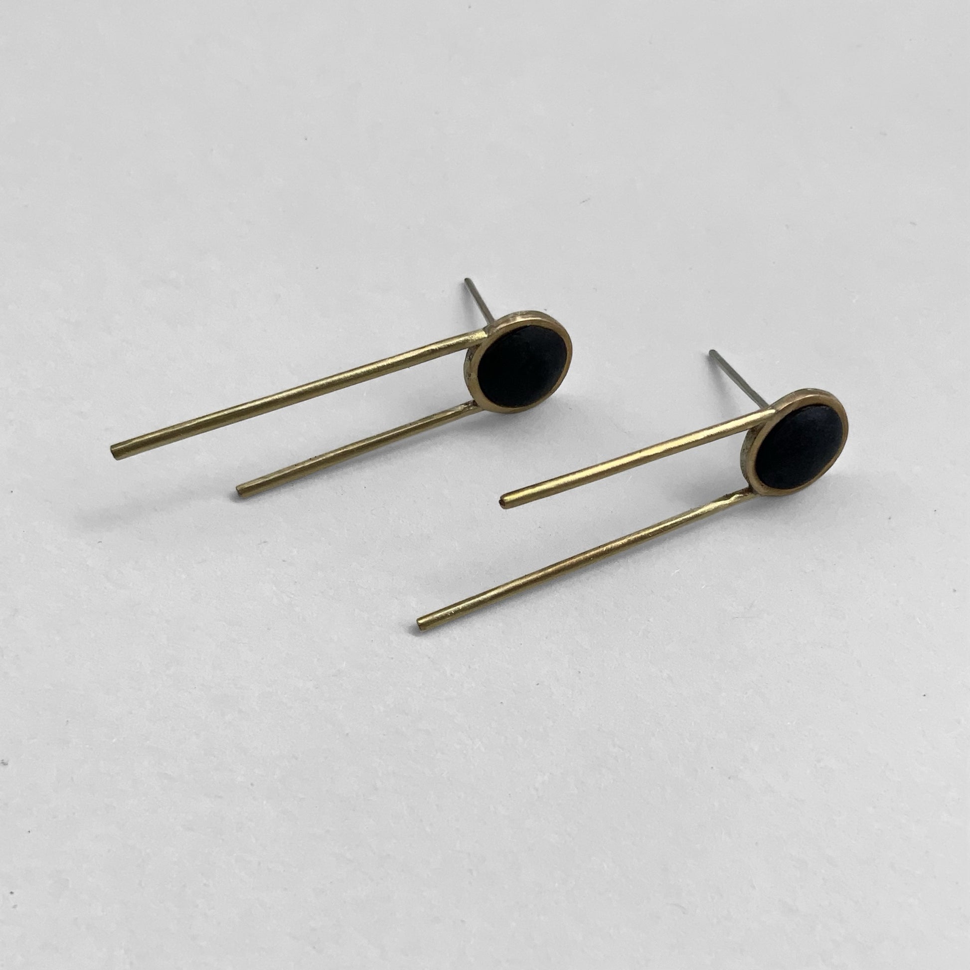 Modern earrings, Minimalist earrings, Black and gold earrings, Geometric earrings, Contemporary jewelry, Long bar earrings, Circle earrings, Stylish earrings, Unique earrings design, Fashion accessories, Elegant earrings, Designer earrings, Trendy jewelry, Statement earrings, Handcrafted earrings