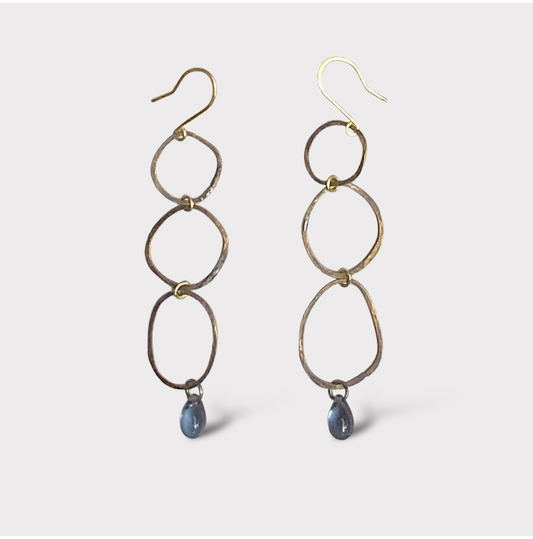 Simple-modern-long-oxidized-brass-earrings-three-circle-links-with-montana-blue-glass-teardrop-bead-at- the-bottom-white-background-product-photo-jewelry-by-meow-iris-collection-maeve-earrings