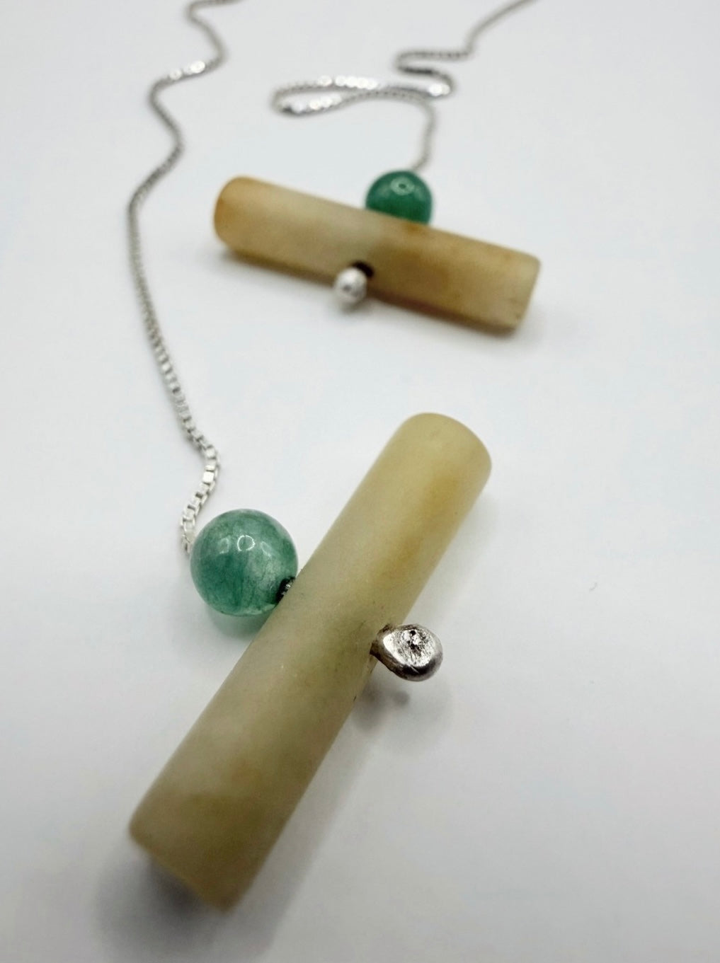 Minimalist sterling silver threader earrings with jadeite and green aventurine angle shot
