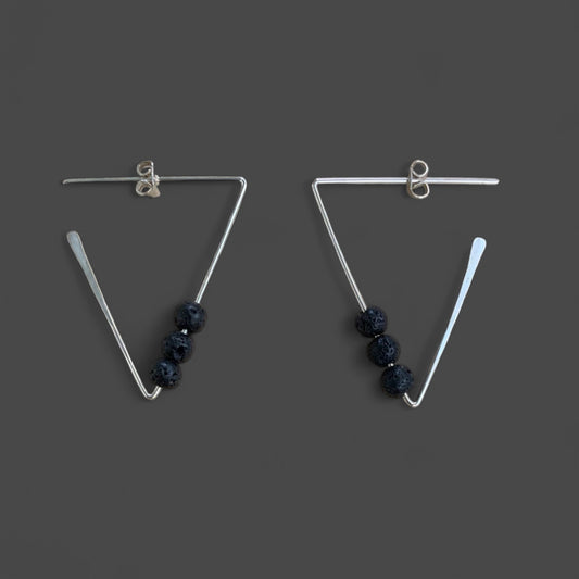 minimalist-triangle-sterling-silver-earrings-with-three-black-lava-stone-beads-product-photography-jewelry-by-meow-eclipse-collection-juno-earrings