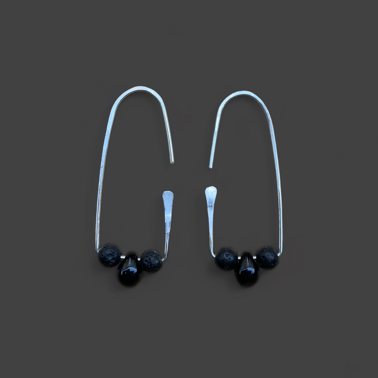 minimalist-hoop-sterling-silver-earrings-with-black-glass-teardrop-bead-and-lava-stones-product-photography-jewelry-by-meow-eclipse-collection-pluto-earrrings