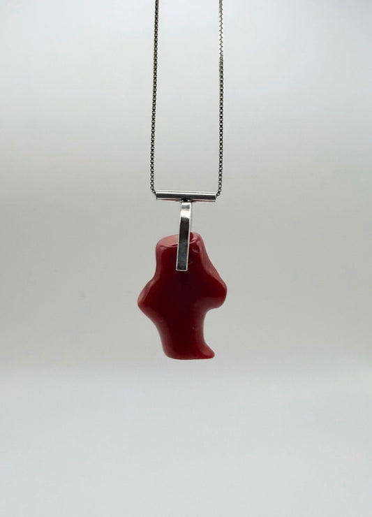 Hanging, front view of the T-bar Coral Sterling Silver Necklace with a red coral pendant and sterling silver T-bar bail on a box chain with a light gray background