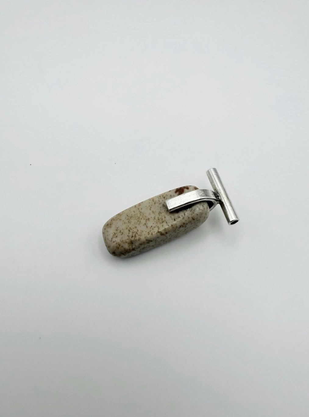 Sterling silver landscape jasper necklace with t-shaped bail pendant shown at an angle