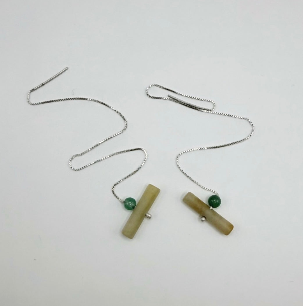 Pair of sterling silver threader earrings with yellow jadeite cylinders and green aventurine beads on a white background