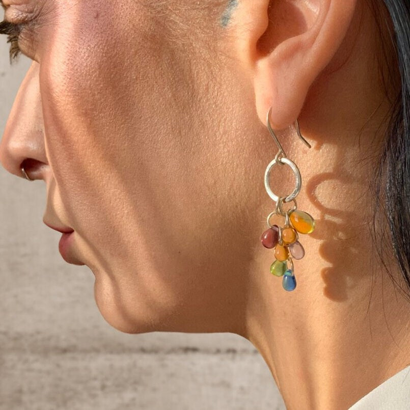 woman-side-profile-wearing-sterling-silver-grape-cluster-light-catcher-earrings-with-multicolored-glass-beads--jewelry-by-meow-iris-collection-olette-earrings-greek-handmade-artisan-unconventional-jewelry